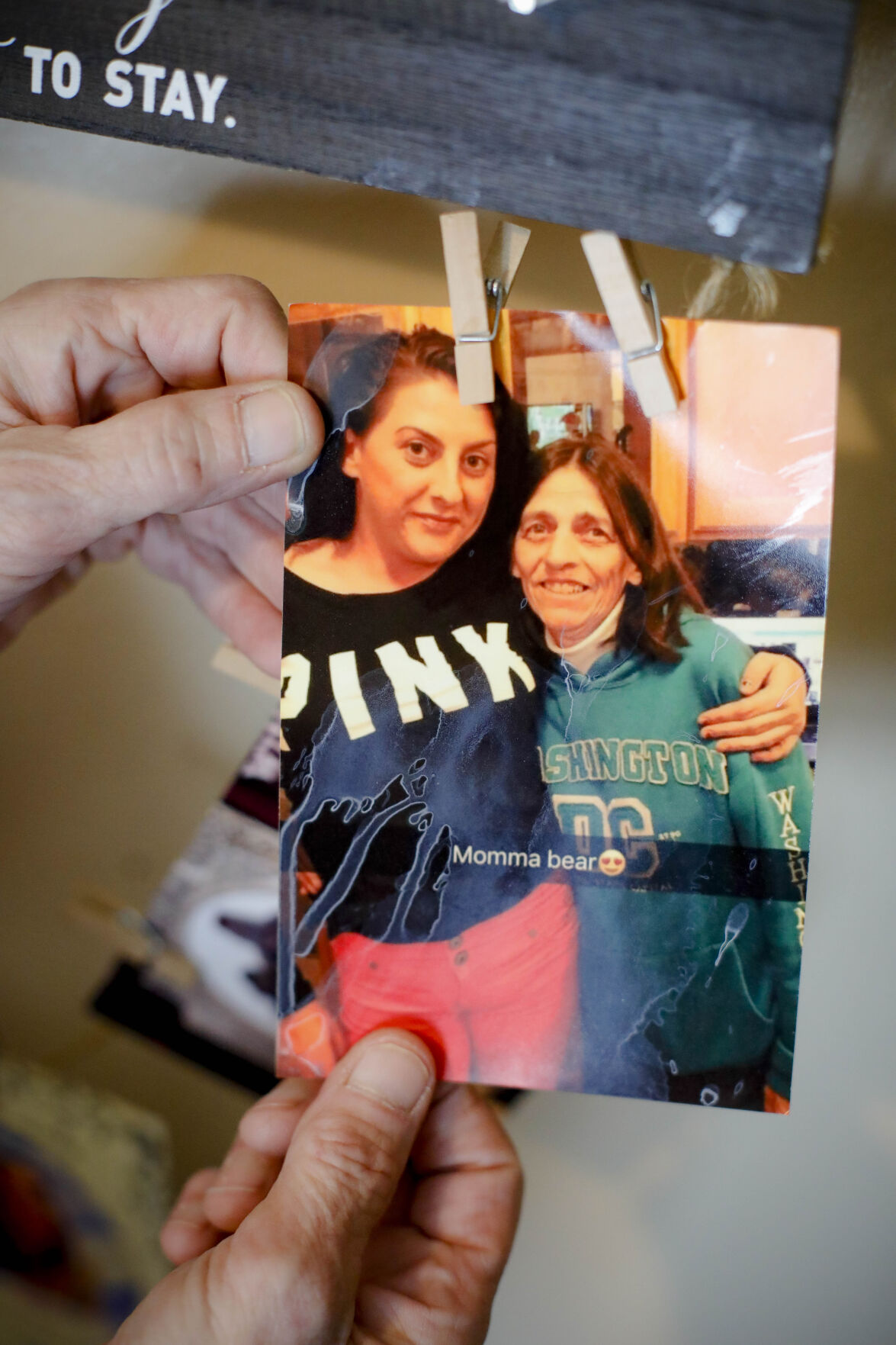 marcia brown holds picture of her and daughter erika